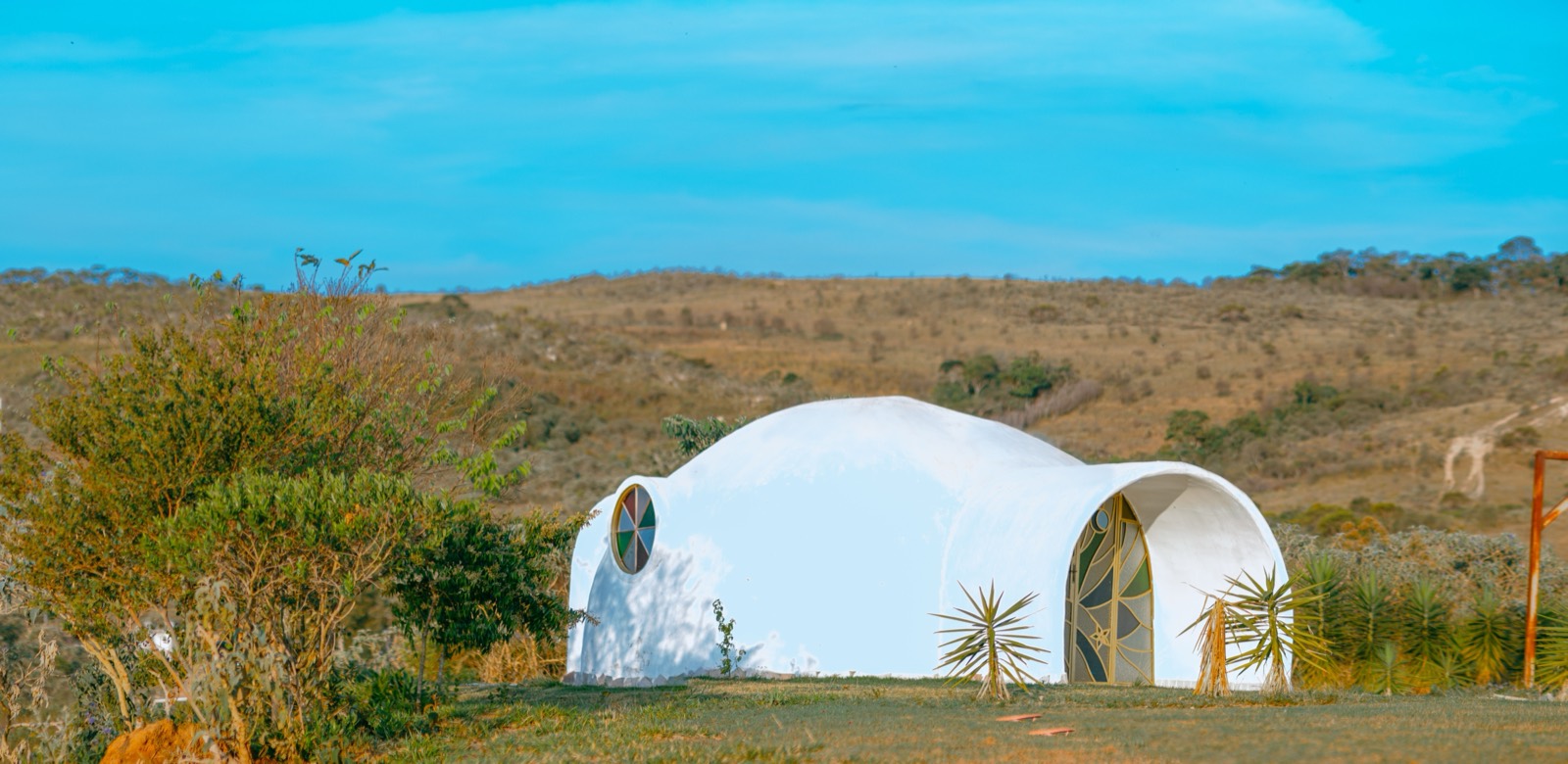 An earthbag superadobe dome house in a landscape