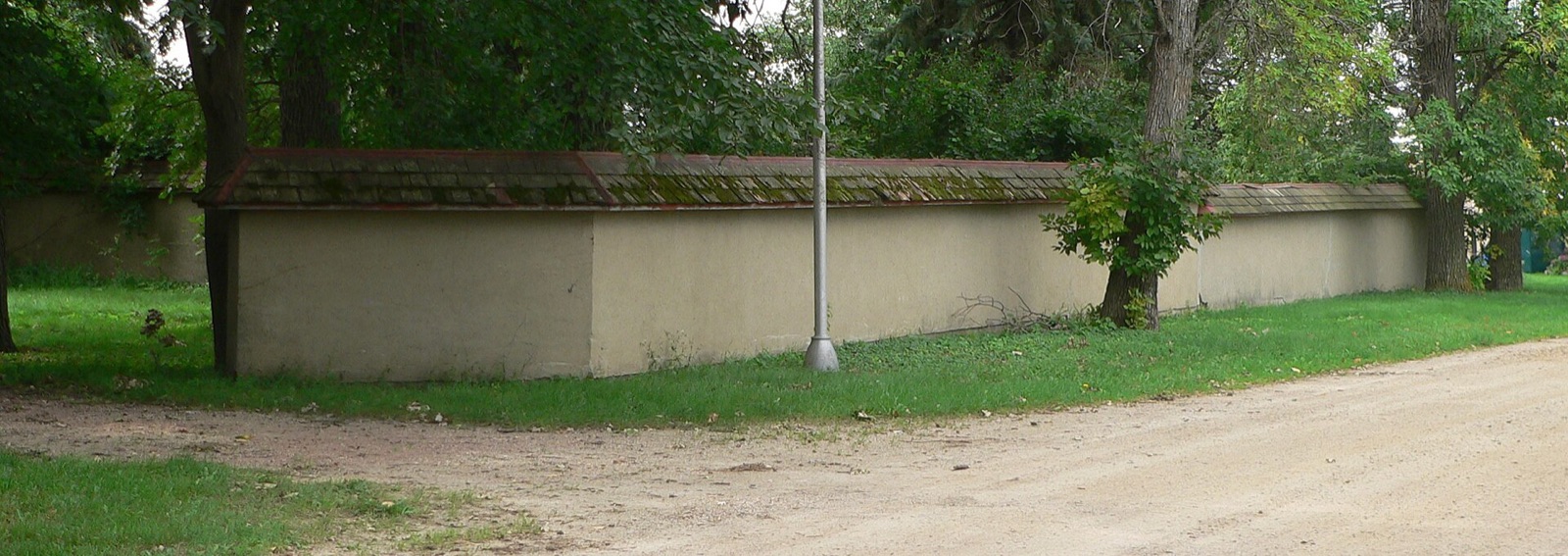 A finished rammed earth wall showing its characteristic layered lifts